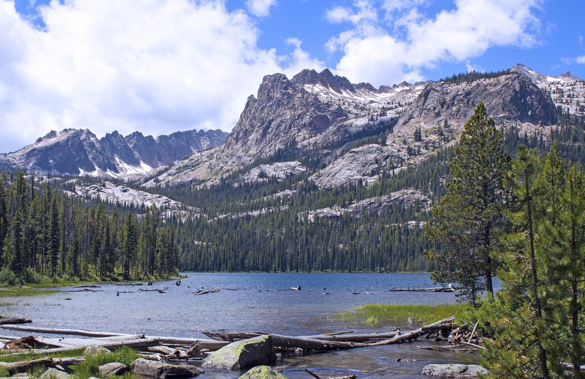 Alpine lake reflecting a dramatic mountain peak in the Idaho wilderness